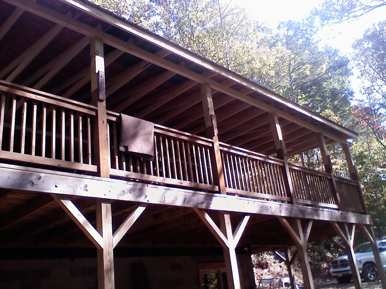 Timber framing under a new elevated porch and deck — Roof Leak Repair in Farmersville by Roofing Brothers